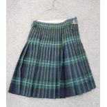 A tartan kilt in shades of blue, green and yellow Condition Report: Not available for this lot