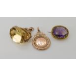 A 9ct gold citrine fob seal, a bright yellow metal ametrine brooch and a yellow metal medallion,