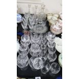 A part suite of Stuart cut crystal drinking glasses with fern motifs, others by Edinburgh crystal, a