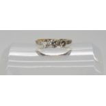 An 18ct and platinum three stone ring set with estimated approx 0.50cts of brilliant cut diamonds,