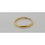 An 18ct gold wedding ring, size P1/2, weight 2.6gms Condition Report: Available upon request