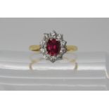 An 18ct gold diamond and faux ruby ring, size L1/2, weight 2.6gms Condition Report: Available upon
