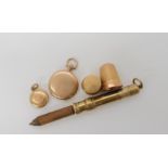 A 9ct gold propelling pencil, thimble, with further items of 9ct and yellow metal weight combined