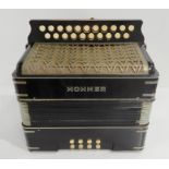 A Hohner 21 button 8 bass C/C push button accordion Condition Report: Available upon request