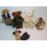 A tray lot including modern Steiff Teddy bears and various dolls Condition Report: Available upon