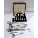 A lot comprising seven pieces of assorted silver cutlery, ladle, butter knife etc. and a cased set