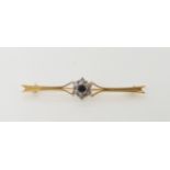 A 9ct diamond and sapphire flower bar brooch, length 5.5cm, weight 3.2gms Condition Report: