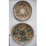 A Charlotte Rhead for Crown Ducal charger with tubelined decoration of orange and yellow flowers,