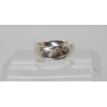 A Georg Jensen silver three stone diamond ring, size L1/2, weight 3.9gms Condition Report: All marks