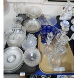 Assorted cut glass and crystal serving plates, bowls, a blue glass footed bowl, two triple ring neck