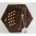 A Lachenal 31 button 6 fold bellows concertina with stamp "English Make Trade Mark" and a carved