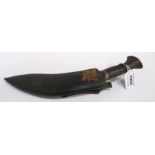 A kukri in scabbard Condition Report: Available upon request