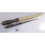 A lot comprising a silver figural handled buttonhook with London import marks 29.5 cm long & a white