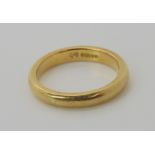 An 18ct gold wedding ring, size L1/2, weight 4.5gms Condition Report: Available upon request
