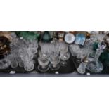 A selection of cut glass and crystal drinking glasses, decanters, blue glass drinking glasses etc
