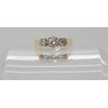 An 18ct gold three stone diamond ring set with estimated approx 0.30cts, finger size L1/2, weight