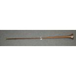 A brass hunting horn, 123 cm long Condition Report: Available upon request