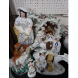 A lot comprising Staffordshire figure groups of couples, ladies with horses etc Condition Report: