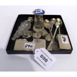 A lot comprising two silver pill boxes, two scent bottles, four assorted silver spoons, a matchbox