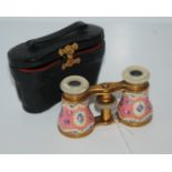 A pair of enamel and mother of pearl opera glasses in original case Condition Report: Available upon