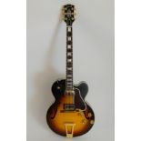 A Gibson ES 275 Custom archtop semi-acoustic electric guitar with sunset burst finish together