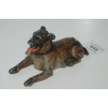 A cold painted metal ashtray modelled as a lying dog with hinged lid, 15cm long Condition Report: