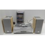 A JVC Compact Component System FS-SD550R cd player with a collection of EMI Now compact discs and