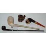 A gilt-metal pipe with amber mouth piece, carved pipe bowl etc Condition Report: Available upon