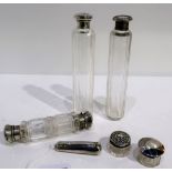 A lot comprising silver topped jars, a cigarette holder case, double ended scent bottle etc.
