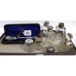 A lot comprising A cased silver dessert spoon, Birmingham 1907, four assorted scent bottles & a pair