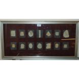 A framed display of ceramic shards, in common mount, 40 x 80cm Condition Report: Available upon