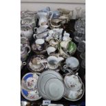 A collection of antique cups and saucers, many floral and gilt decorated, copper lustre jugs, a