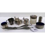 A lot comprising five assorted silver condiments, a silver topped jar, a small silver tyg & a pair
