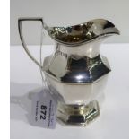 A silver cream jug, London 1917 12.5 cm. high 220 grams Condition Report: Available upon request