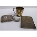 A lot comprising a silver christening mug, Birmingham 1941, a silver vesta & two silver cigarette