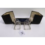 A cased pair of silver toastracks, Sheffield 1921 Condition Report: Available upon request