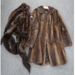 A ladies brown fur coat, three fur shrugs, a fur hair piece Condition Report: Not available for this
