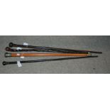 A white-metal mounted walking cane and three other walking canes (4) Condition Report: Available