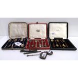 A lot comprising two cased sets of six silver coffee spoons, a part set (5) silver gilt & enamel