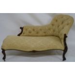 A VICTORIAN WALNUT CHAISE LOUNGE with three quarter scroll button back above a shaped seat and on