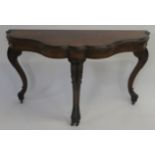 A VICTORIAN ROSEWOOD SCROLL SHAPED CARD TABLE with hinged top enclosing green baize interior,