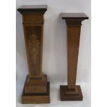 AN EDWARDIAN ROSEWOOD AND INLAID SQUARE PEDESTAL with ribbon tied foliate panel on a stepped base,