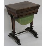 A VICTORIAN ROSEWOOD SEWING AND GAMES TABLE the hinged top enclosing a chequer board above a sliding