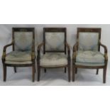 THREE EMPIRE PERIOD MAHOGANY ARMCHAIRS a matching pair with gilt metal mounts and scroll arms,