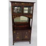 A GLASGOW STYLE MAHOGANY AND MARQUETRY DISPLAY CABINET with overhanging cornice above bevelled glass