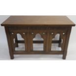 AN OAK ALTER TABLE carved with inscription 'This do in remembrance of me', flanked by grapes and