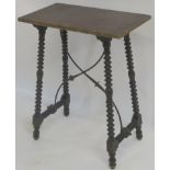 A SPANISH WALNUT SIDE TABLE the rectangular top with carved gilt edge above bobbin turned legs,