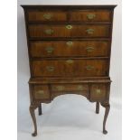 A WILLIAM AND MARY STYLE WALNUT CHEST ON STAND the ogee cornice above two short and three long