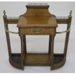 A SHOOLBRED OAK AND BRASS HALLSTAND with brass baluster rails above a single drawer and flanked by