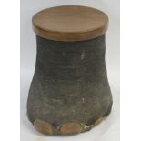 AN ELEPHANTS FOOT STOOL with hardwood seat above staved interior, 46cm high and 33cm diameter